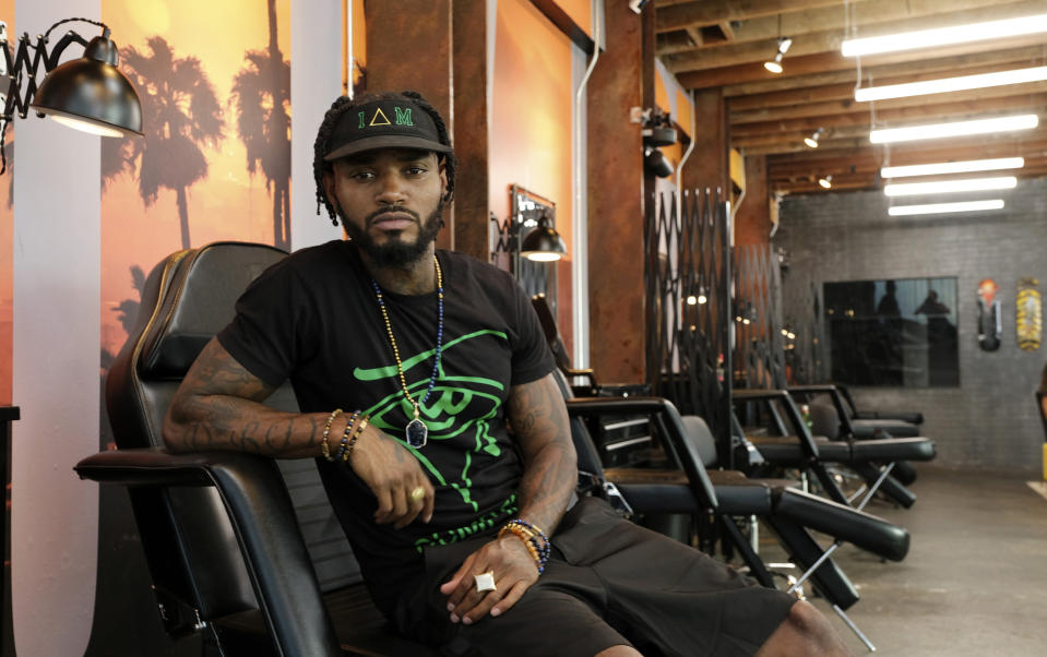 CORRECTS LAST NAME TO KIRKPATRICK FROM KILPATRICK This Aug. 15, 2019 photo shows Danny “KP” Kirkpatrick, a cast member in the reality television series "Black Ink Crew: Compton," at the IAM Compton tattoo shop in Compton, Calif. The show, which airs Wednesdays on VH1, follows the cast who attempt to create a “safe zone” in one of the tougher cities in California. The reality series is the third spinoff of the “Black Ink Crew” franchise. (Photo by Chris Pizzello/Invision/AP)