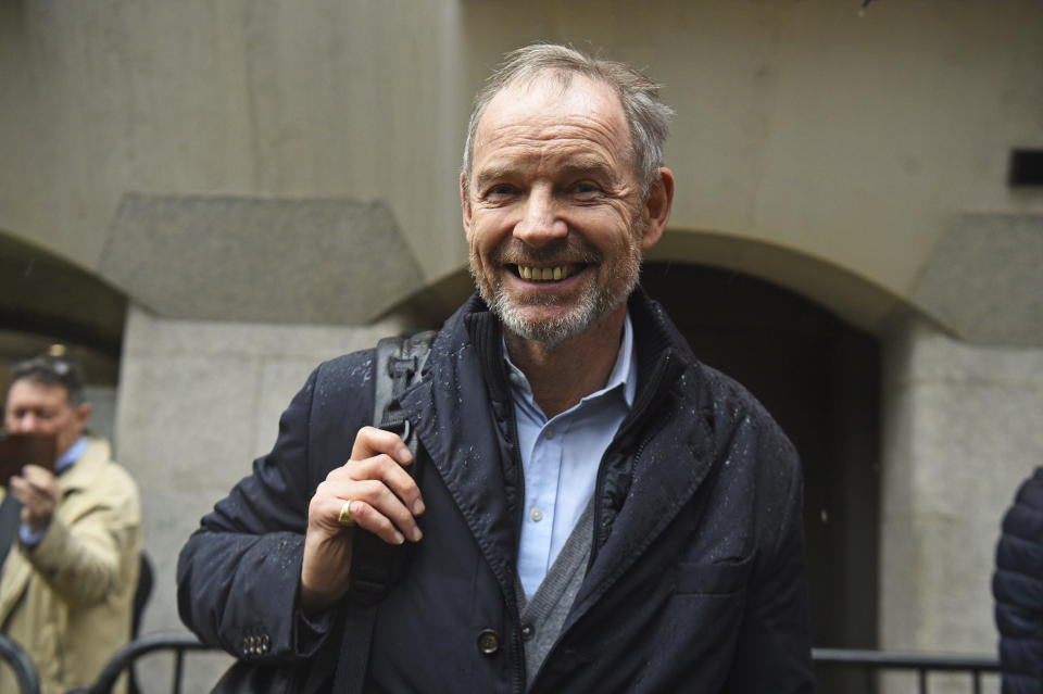 Richard Boath smiles outside the Old Bailey, London, Friday Feb. 28, 2020. Three former Barclays bankers have been cleared of fraud over a 4 billion-pound ($5.2 billion) investment deal with Qatar at the height of the global financial crisis in 2008. The three men — Roger Jenkins, Thomas Kalaris and Richard Boath — were acquitted Friday after a five-month trial at London's Old Bailey. (Kirsty O'Connor/PA via AP)