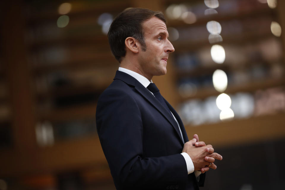 French President Emmanuel Macron speaks on camera as he arrives for an EU summit at the European Council building in Brussels, Thursday, Oct. 1, 2020. European Union leaders are meeting to address a series of foreign affairs issues ranging from Belarus to Turkey and tensions in the eastern Mediterranean. (AP Photo/Francisco Seco, Pool)
