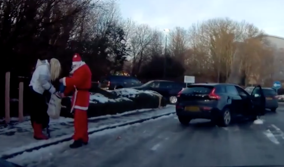 <em>Surprise – Santa even helped the woman collect up her shopping and put her hat back on </em>