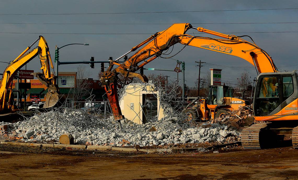 An excavator with a powerful chisel attachment works at breaking apart a bank vault at the former U.S. Bank branch on West Court Street in Pasco. The demolition work is part of a project to redevelop the site for a new Bruchi’s CheeseSteaks & Subs restaurant and a Baskin Robbins ice cream shop. Bob Brawdy/bbrawdy@tricityherald.com