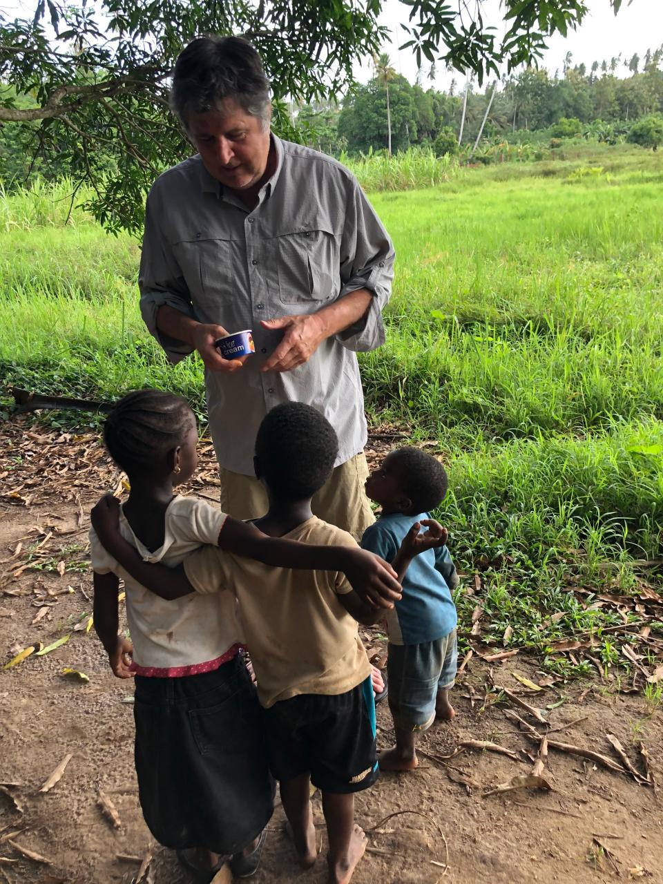 Mike Leach speaks with children in Zanzibar in 2021.