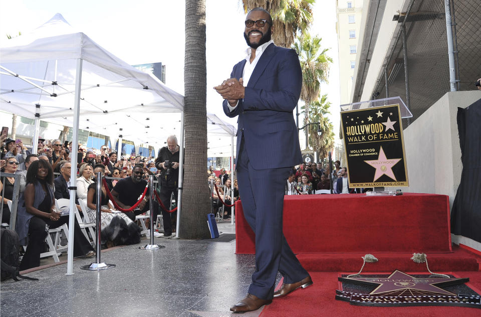 FILE - Filmmaker/actor Tyler Perry, known for the "Madea" films, appears during a ceremony honoring him with with a star on the Hollywood Walk of Fame on Oct. 1, 2019, in Los Angeles. Perry turns 51 on Sept. 14. (Photo by Richard Shotwell/Invision/AP, File)