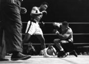 <p>LOS ANGELES – NOVEMBER 15,1962: Cassius Clay (L) knocks down Archie Moore during the fight at the Sports Arena on November 15,1962 in Los Angeles, California. Cassius Clay won by a TKO 4. (Photo by: The Ring Magazine/Getty Images)</p>
