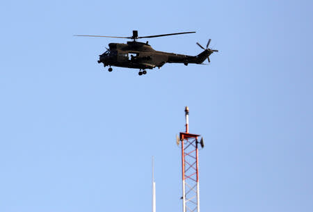 A NATO helicopter flies over the Resolute Support headquarters in Kabul, Afghanistan November 3, 2018.REUTERS/Mohammad Ismail