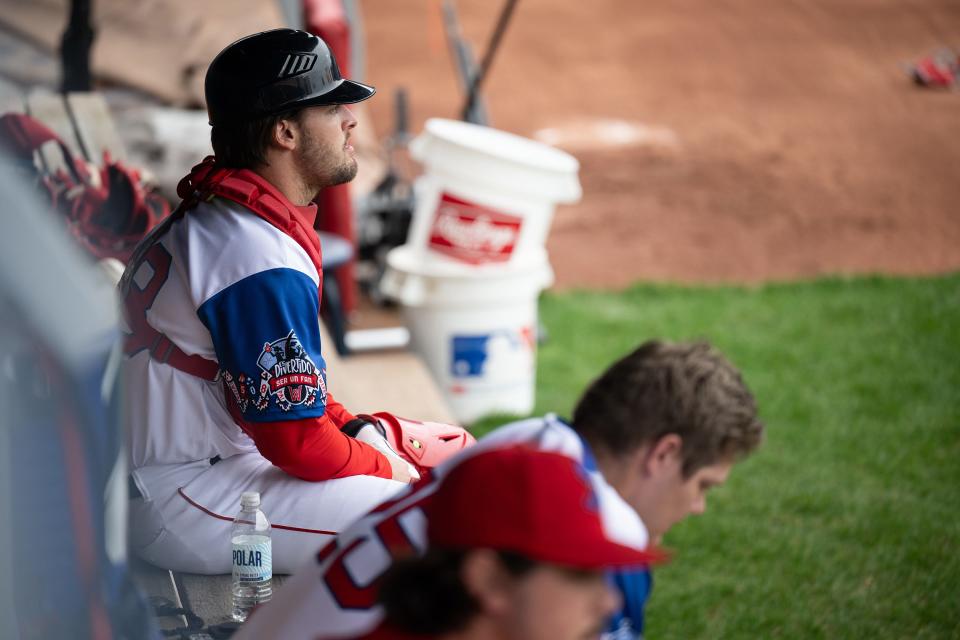 WooSox catcher Nathan Hickey (left) and starting pitcher Richard Fitts sit in the bullpen after warming up to face the Lehigh Valley IronPigs.