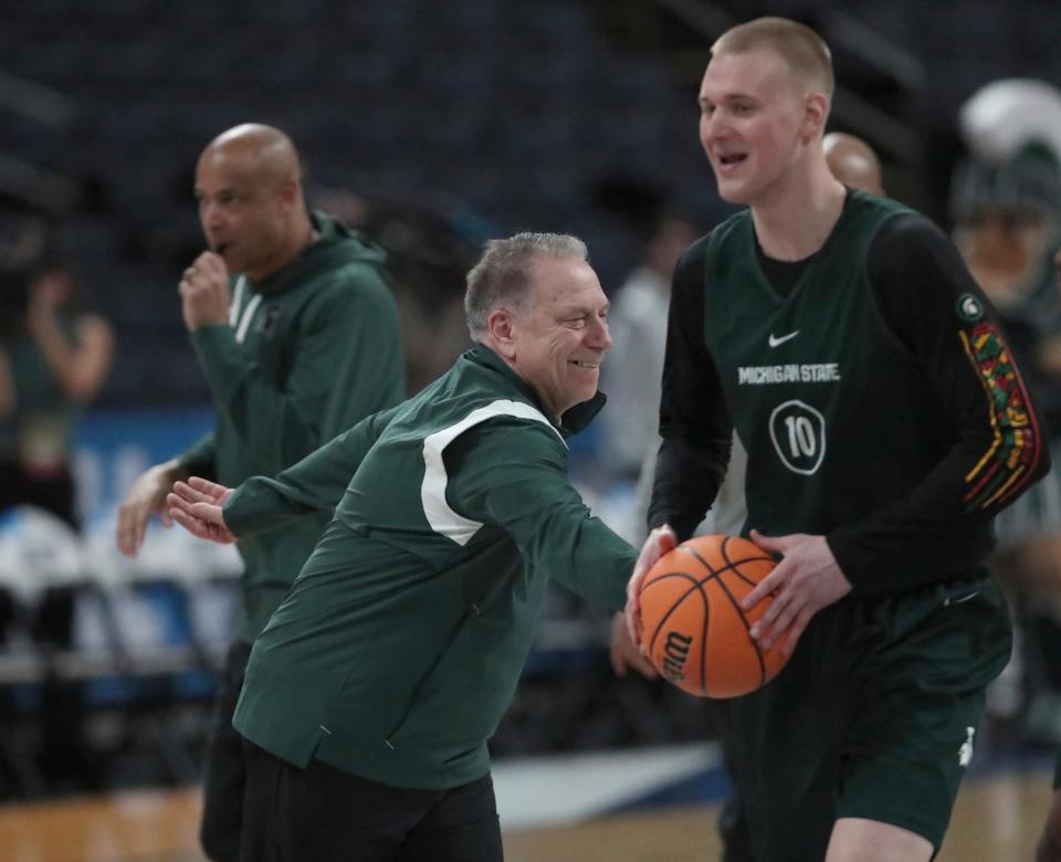 Michigan State Spartans heads coach Tom Izzo and forward Joey Hauser (10) have a laugh during practice for their first round NCAA Tournament game against the USC Trojans Thursday, March 16, 2023.