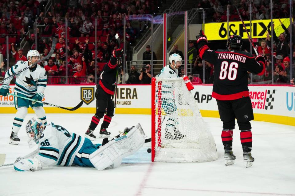 Oct 27, 2023; Raleigh, North Carolina, USA; Carolina Hurricanes left wing Teuvo Teravainen (86) scores a goal past San Jose Sharks goaltender Kaapo Kahkonen (36) during the first period at PNC Arena. Mandatory Credit: James Guillory-USA TODAY Sports