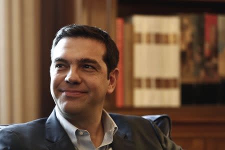 Alexis Tsipras, leader of Greece's far-left Syriza party smiles during a meeting with Greek President Karolos Papoulias (not pictured) at the Presidential palace in Athens November 3, 2014. REUTERS/Yorgos Karahalis