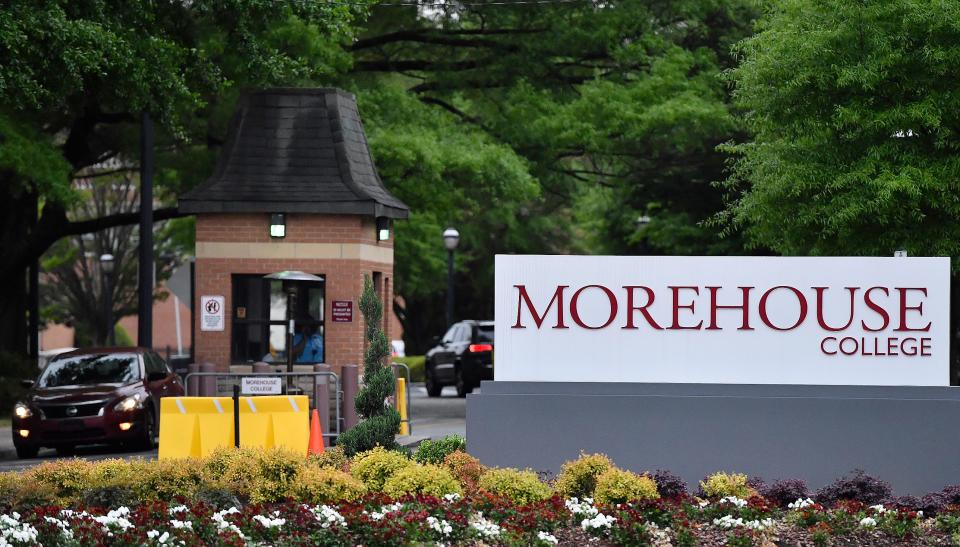 In this Friday, April 12, 2019 photo, people enter the campus of Morehouse College in Atlanta. The country's only all-male historically black college will begin admitting transgender men next year. The move marks a major shift for Morehouse College at a time when higher education institutions around the nation are adopting more welcoming policies toward LGBT students. Morehouse College leaders told The Associated Press that its board of trustees approved the policy Saturday. (AP Photo/Mike Stewart)