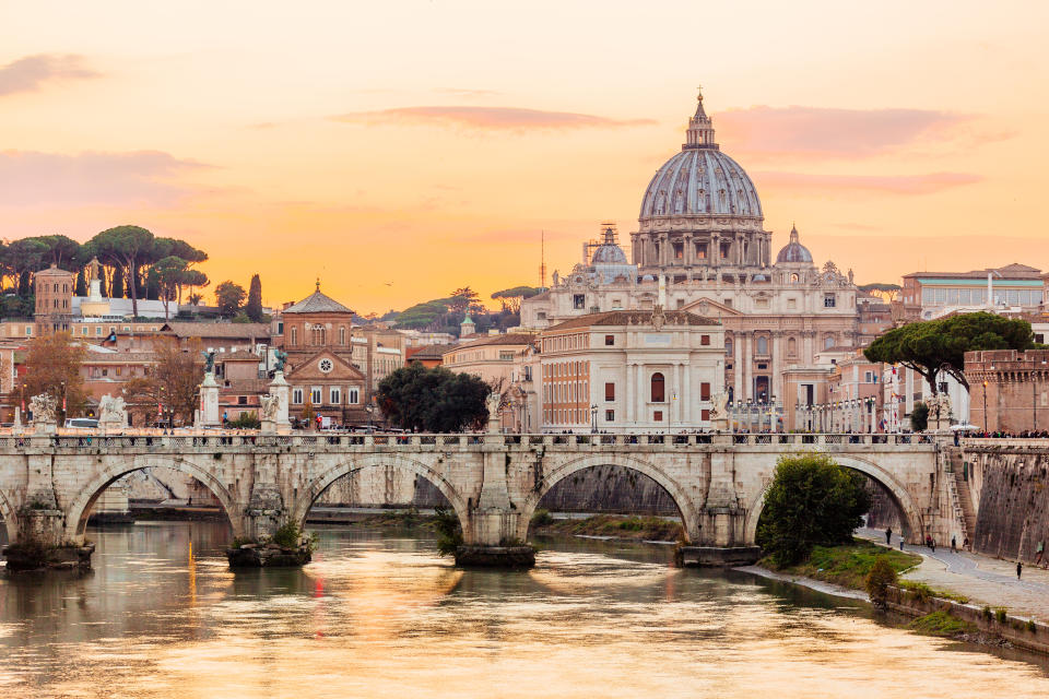 A bridge over water in Rome at sunset 