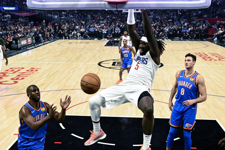 Los Angeles Clippers' Montrezl Harrell (5) dunks against the Oklahoma City Thunder during the first half of an NBA basketball game, Monday, Nov. 18, 2019, in Los Angeles. (AP Photo/Ringo H.W. Chiu)