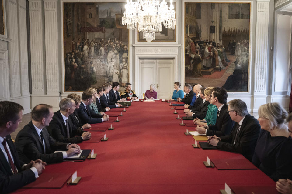 Denmark's Queen Margrethe II signs a declaration of abdication in the Council of State meeting, at Christiansborg Castle in Copenhagen, Sunday, Jan. 14, 2024. Queen Margrethe II has signed her historic abdication, paving the way for her son Frederik X to immediately become king. (Mads Claus Rasmussen/Ritzau Scanpix via AP)