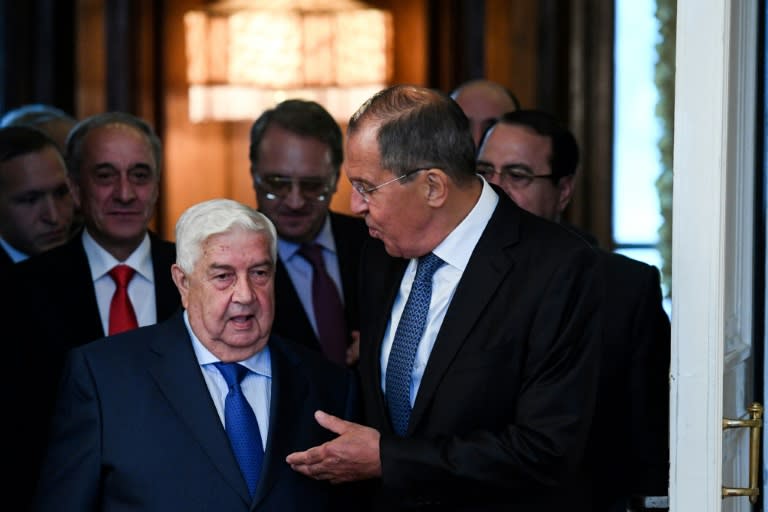 Russian Foreign Minister Sergei Lavrov gestures as he welcomes his Syrian counterpart Walid Muallem in Moscow on August 30, 2018