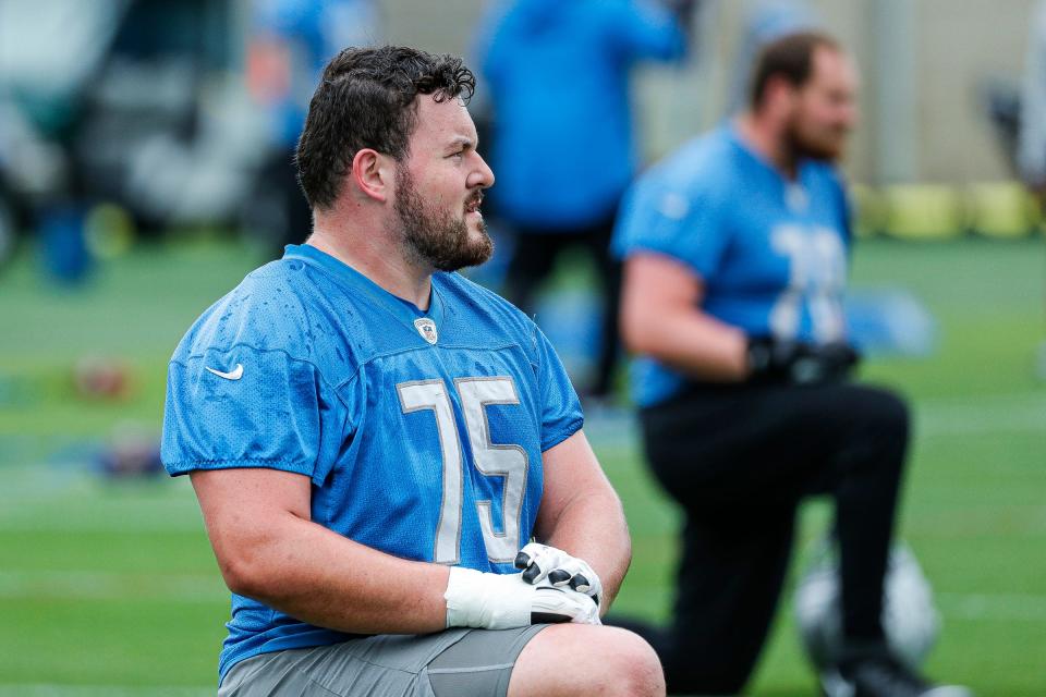 Detroit Lions guard Kevin Jarvis warms up during mini camp at the practice facility in Allen Park on Tuesday, June 7, 2022.