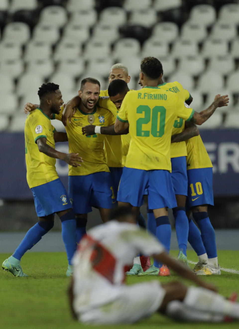 Brazil's Everton Ribeiro, second from left, celebrates with teammates after scoring his side's 3rd goal during a Copa America soccer match against Peru at Nilton Santos stadium in Rio de Janeiro, Brazil, Thursday, June 17, 2021. (AP Photo/Bruna Prado)