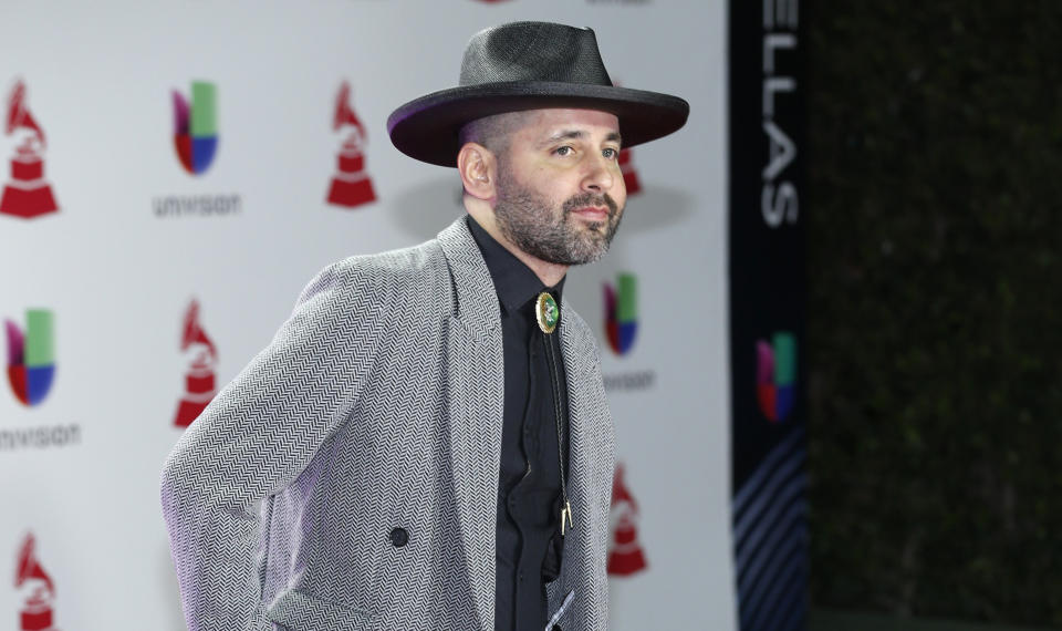 FILE - In this Nov. 15, 2018, file photo, Eduardo Cabra, of Calle 13, arrives at the Latin Grammy Awards in Las Vegas. Cabra killed off his "Visitante" persona in the graphic new video "La Cabra Jala Pal Monte," stepping into the forefront for the first time as CABRA with his newly formed record label, La Casa del Sombrero. (Photo by Eric Jamison/Invision/AP, File)