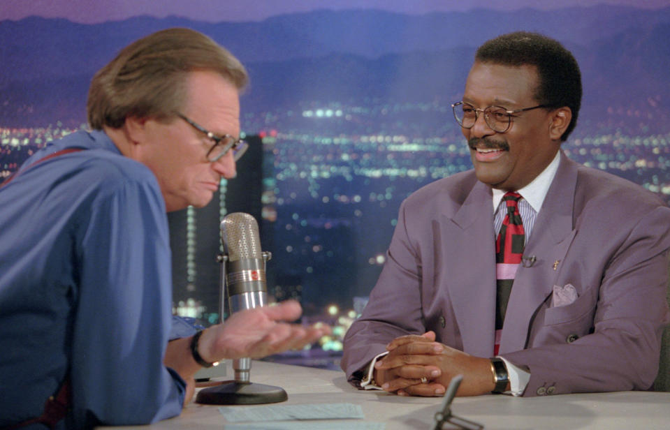 FILE - In this Oct. 4, 1995 file photo, Defense attorney Johnnie Cochran Jr., right, sits for an interview with Larry King, the host of the "Larry King Live" show in the Hollywood section of Los Angeles. King, who interviewed presidents, movie stars and ordinary Joes during a half-century in broadcasting, has died at age 87. Ora Media, the studio and network he co-founded, tweeted that King died Saturday, Jan. 23, 2021 morning at Cedars-Sinai Medical Center in Los Angeles. (AP Photo/Damian Dovarganes, File)