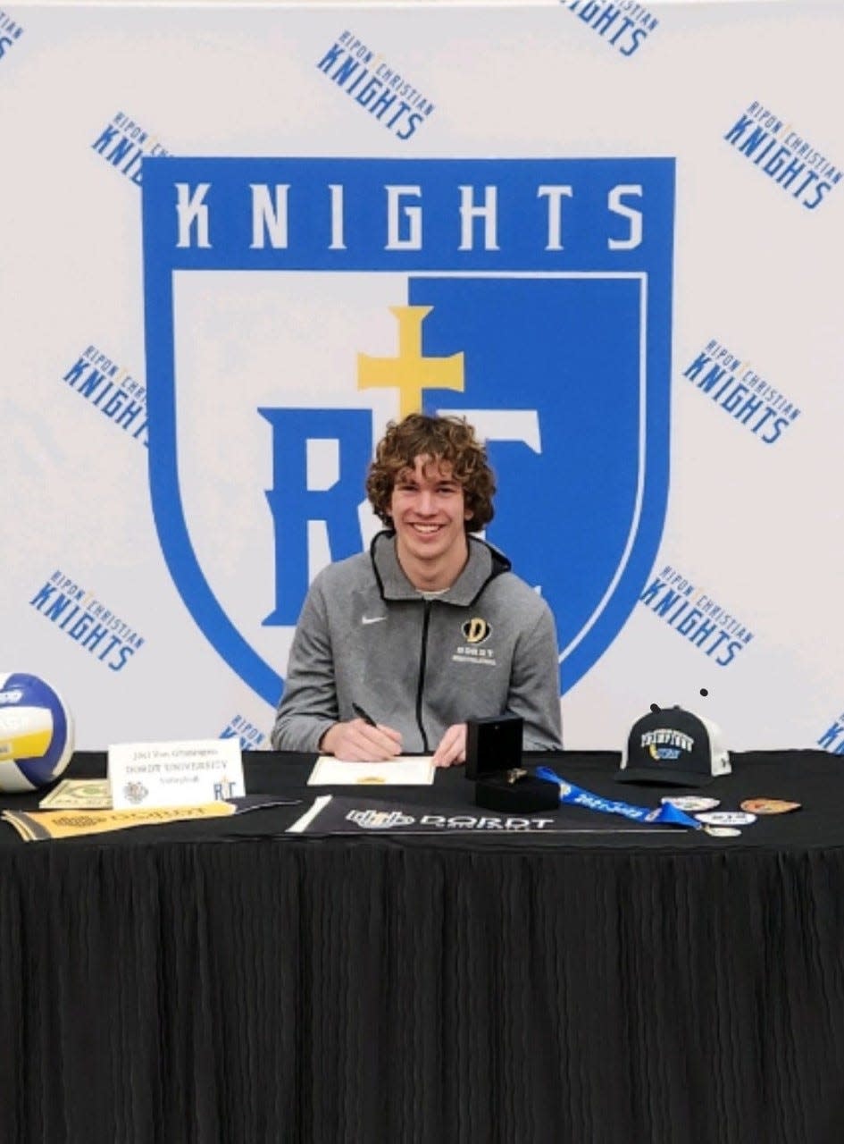 Joel Van Groningen signs his letter of intent to play volleyball in college at Ripon Christian High School.