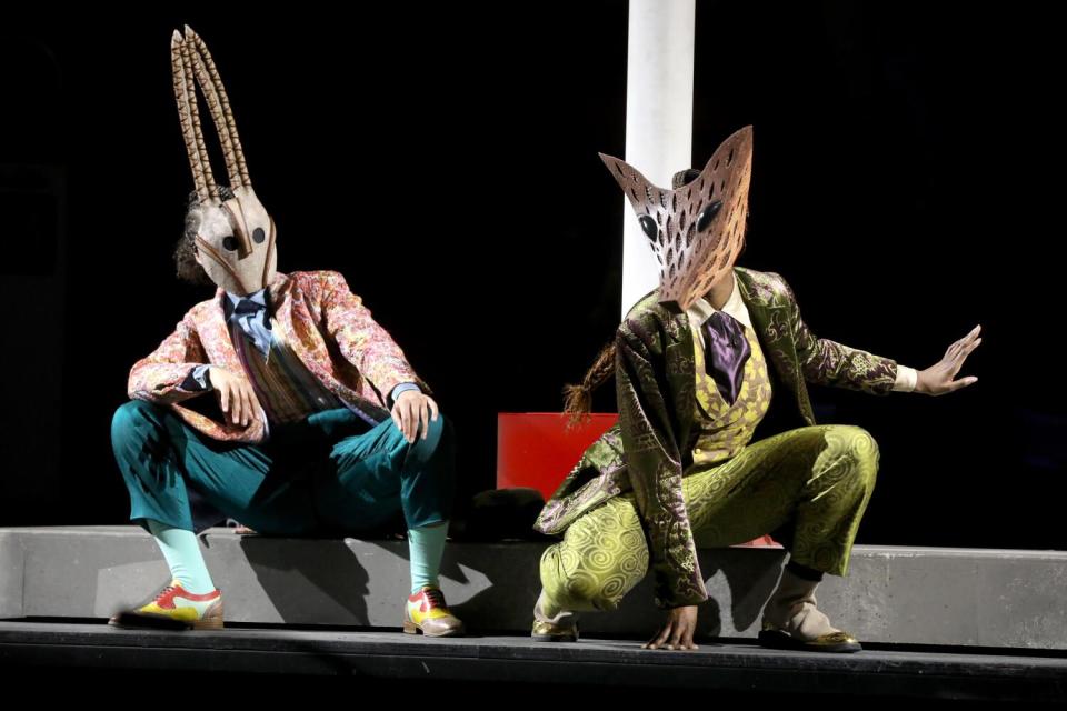 Two dancers costumed as a fox and rabbit in William Grant Still's "Highway 1, USA"