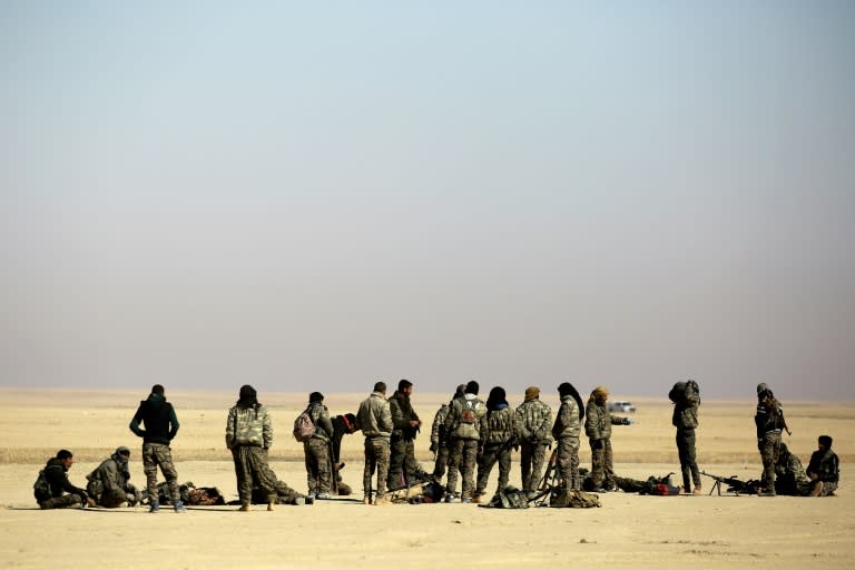 Fighters from the Syrian Democratic Forces gather near a village north-east of Raqa