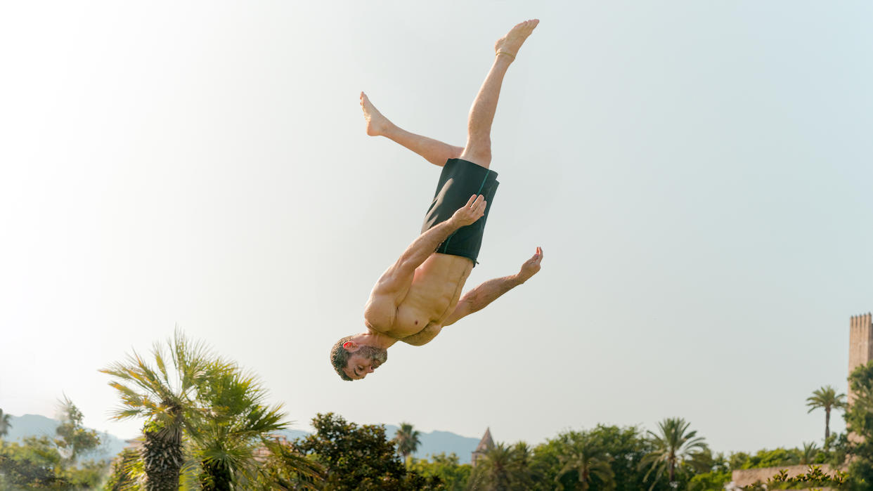  Man levitating like superhero, superman, somersaults and jumps, stunts and free running, capoeira. 