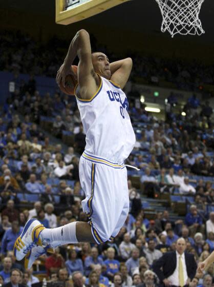 UCLA's Drew Gordon goes up for a dunk during a basketball game against USC