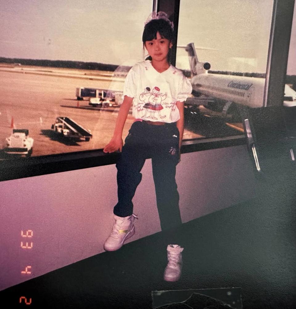 Lily Wu poses at Mid-Continent Airport on April 2, 1993, the day her family arrived in Wichita from Guatemala.