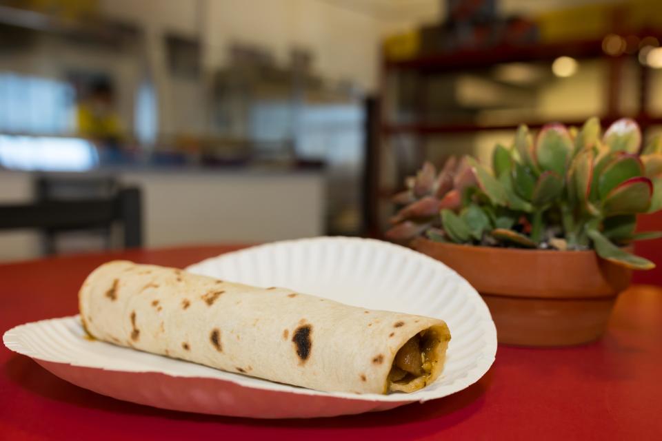 At their Lee Trevino location in El Paso, Texas, an employee prepared a chicharron burrito from Burritos Crisostomo on Wednesday, April 6, 2022.