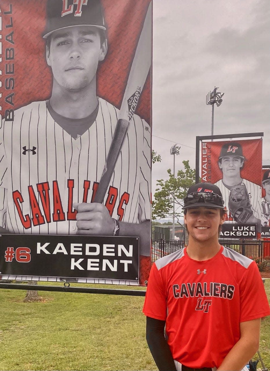 Lake Travis senior Kaeden Kent, posing in front of a stadium poster that bears his name, said his first coach was his dad, former big leaguer Jeff Kent.