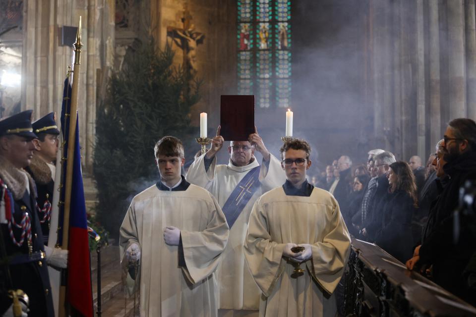 People attend a mass commemorating the victims of a shooting at one of Charles University's buildings as they observe a national mourning day at St. Vitus Cathedral in Prague, Czech Republic, on Saturday (REUTERS)