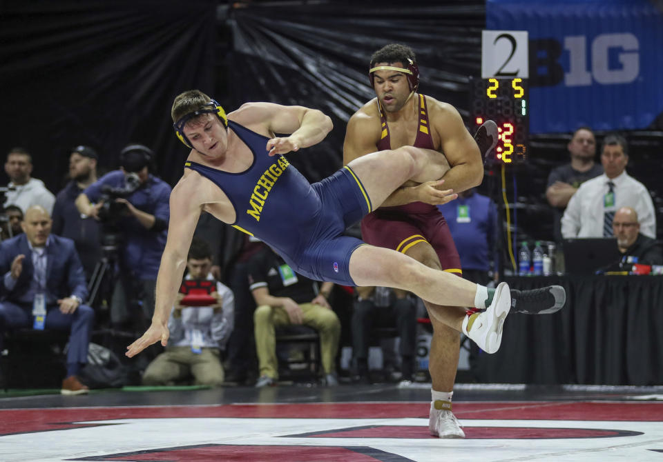 FILE - Minnesota's Gable Steveson, right, takes down Michigan's Mason Parris en route to an 8-6 decision in the 285-pound final bout at the Big Ten Wrestling Championships in Piscataway, N.J., Sunday, March 8, 2020. Reigning Olympic gold medalist Gable Steveson did not compete in the 2024 trials. Mason Parris earned the heavyweight slot in freestyle and has the tall task of filling Steveson’s shoes. (Andrew Mills/NJ Advance Media via AP, File)