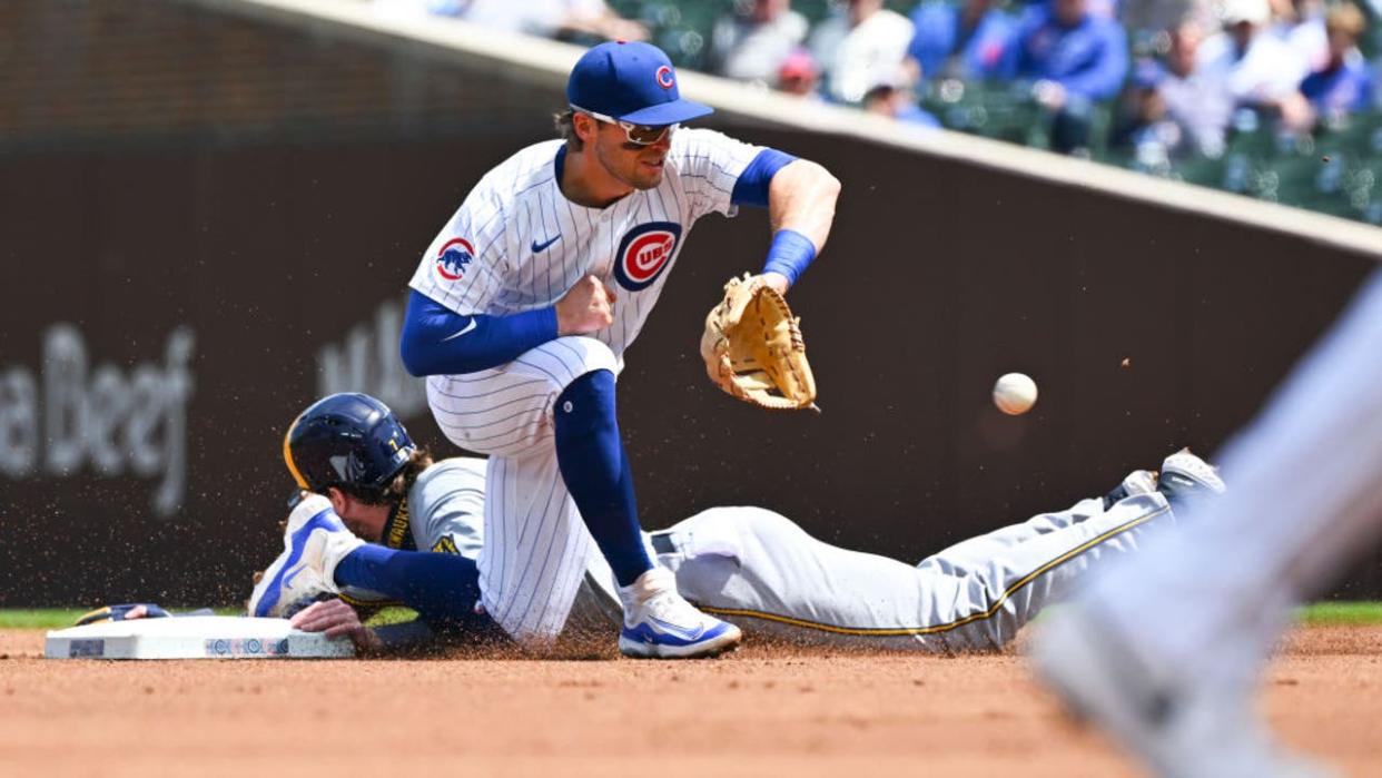 <div>CHICAGO, ILLINOIS - MAY 03: Tyler Black #7 of the Milwaukee Brewers steals second base against Nico Hoerner #2 of the Chicago Cubs during the fir inning at Wrigley Field on May 03, 2024 in Chicago, Illinois. (Photo by Nuccio DiNuzzo/Getty Images)</div>