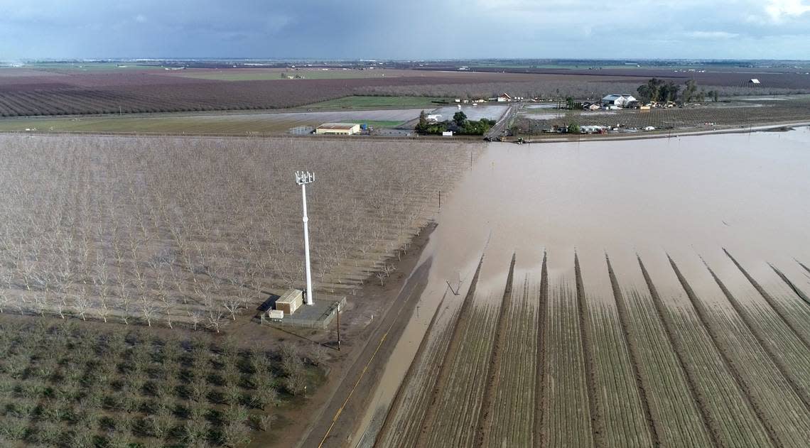 Water from the Orestimba Creek flooded an orchard and farmland along Anderson Road in Newman, Calif., Tuesday, Jan. 10, 2023.