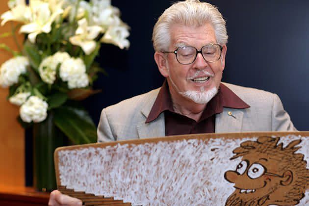 Rolf Harris plays the Wobble Board during a literary lunch in 2008. Photo: Getty