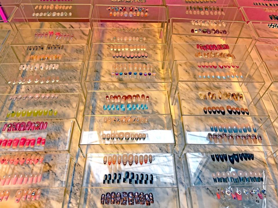 different nail designs and colors on display at tokyo nails in chicago