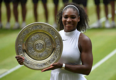 FILE PHOTO: Britain Tennis - Wimbledon - All England Lawn Tennis & Croquet Club, Wimbledon, England - 9/7/16 USA's Serena Williams celebrates winning her womens singles final match against Germany's Angelique Kerber with the trophy REUTERS/Toby Melville Picture Supplied by Action Images/File Photo