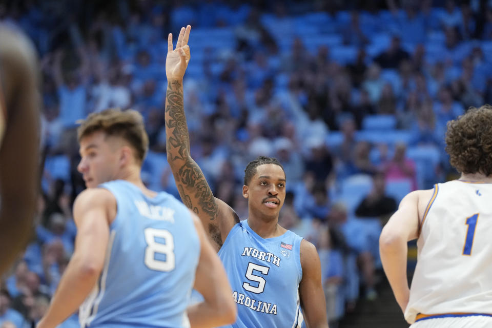 Nov 17, 2023; Chapel Hill, North Carolina, USA; North Carolina Tar Heels forward <a class="link " href="https://sports.yahoo.com/ncaab/players/153906" data-i13n="sec:content-canvas;subsec:anchor_text;elm:context_link" data-ylk="slk:Armando Bacot;sec:content-canvas;subsec:anchor_text;elm:context_link;itc:0">Armando Bacot</a> (5) reacts after hitting a three point shot in the second half at Dean E. Smith Center. Mandatory Credit: Bob Donnan-USA TODAY Sports