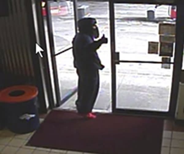 A still image of a robbery suspect is shown from security camera video in this handout photo provided by the Jefferson County Sheriff's Office in Arvada, Colorado January 15, 2015. Police in Colorado are hunting a hooded man who was about to rob a convenience store but stopped after recognizing the clerk and then the startled employee a cheery "thumbs-up". REUTERS/Jefferson County Sheriff's Office/Handout via Reuters (UNITED STATES - Tags: CRIME LAW)ATTENTION EDITORS - FOR EDITORIAL USE ONLY. NOT FOR SALE FOR MARKETING OR ADVERTISING CAMPAIGNS. THIS PICTURE WAS PROVIDED BY A THIRD PARTY. REUTERS IS UNABLE TO INDEPENDENTLY VERIFY THE AUTHENTICITY, CONTENT, LOCATION OR DATE OF THIS IMAGE. THIS PICTURE IS DISTRIBUTED EXACTLY AS RECEIVED BY REUTERS, AS A SERVICE TO CLIENTS