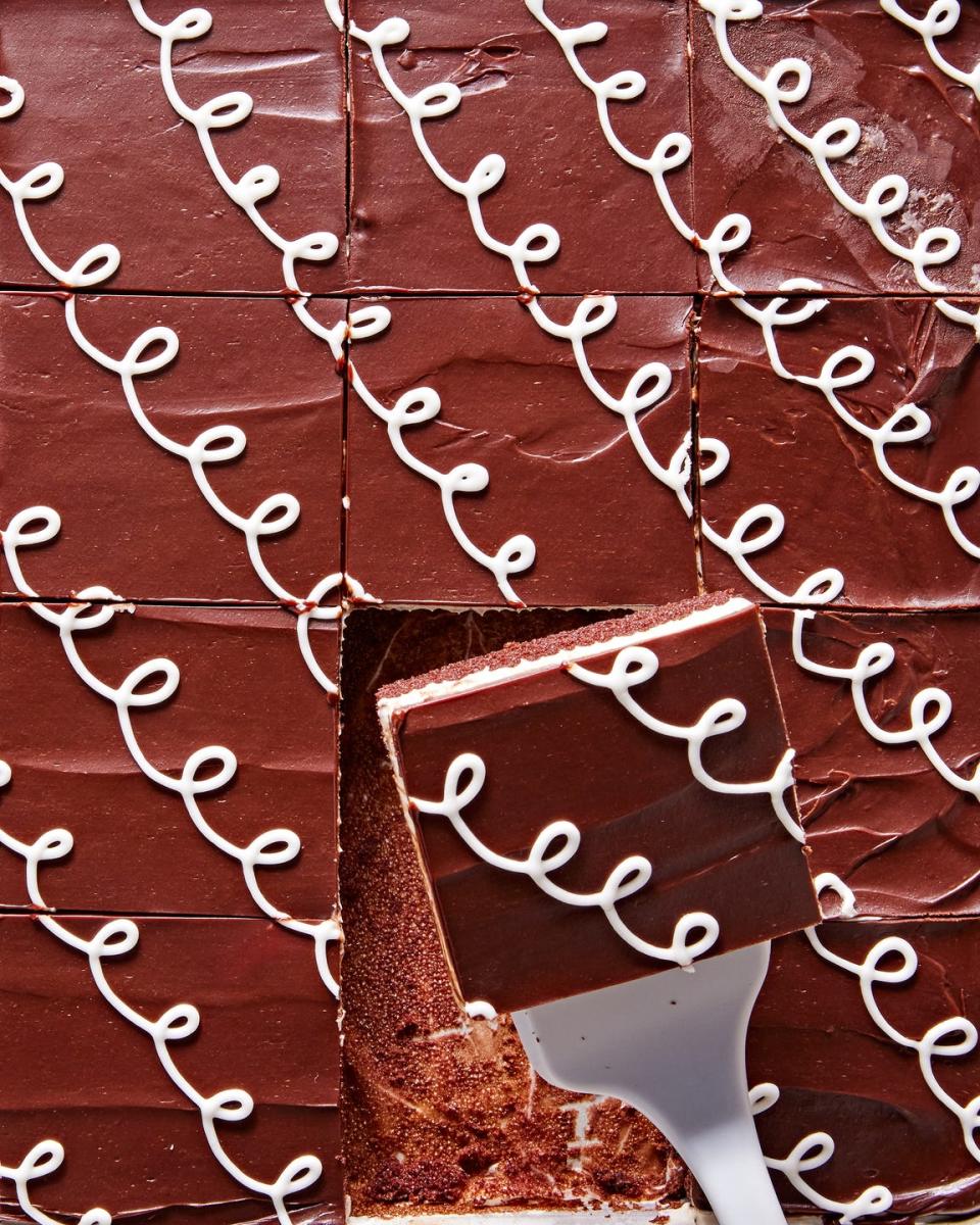 chocolate sheet cake with white piped icing