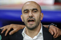 FILE - Morocco's coach Walid Regragui sings the national anthem prior to the start of an international friendly soccer match between Morocco and Chile at the Cornella-El Prat stadium in Barcelona, Spain, Friday, Sept. 23, 2022. (AP Photo/Joan Monfort, File)