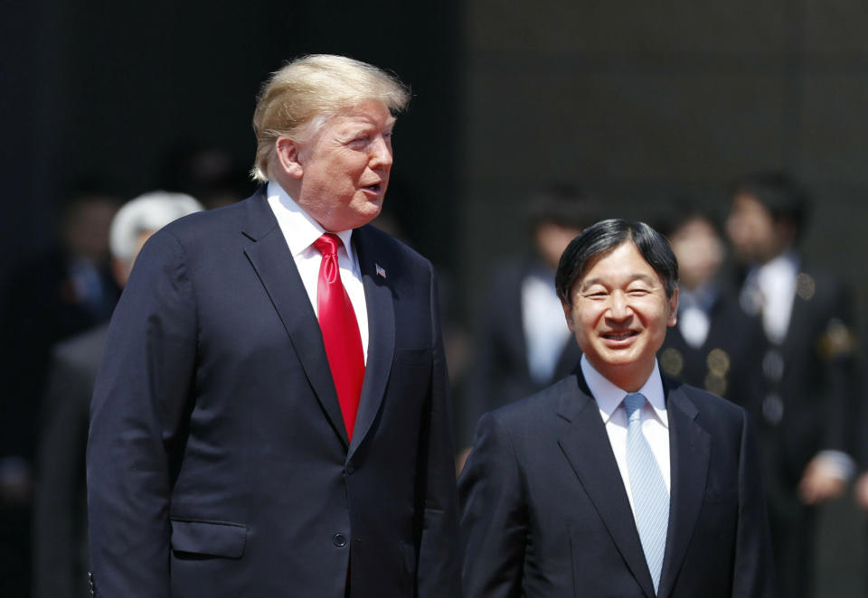 U.S. President Donald Trump, left, is escorted by Japan's Emperor Naruhito during an welcome ceremony at the Imperial Palace in Tokyo Monday, May 27, 2019. (Issei Kato/Pool Photo via AP)