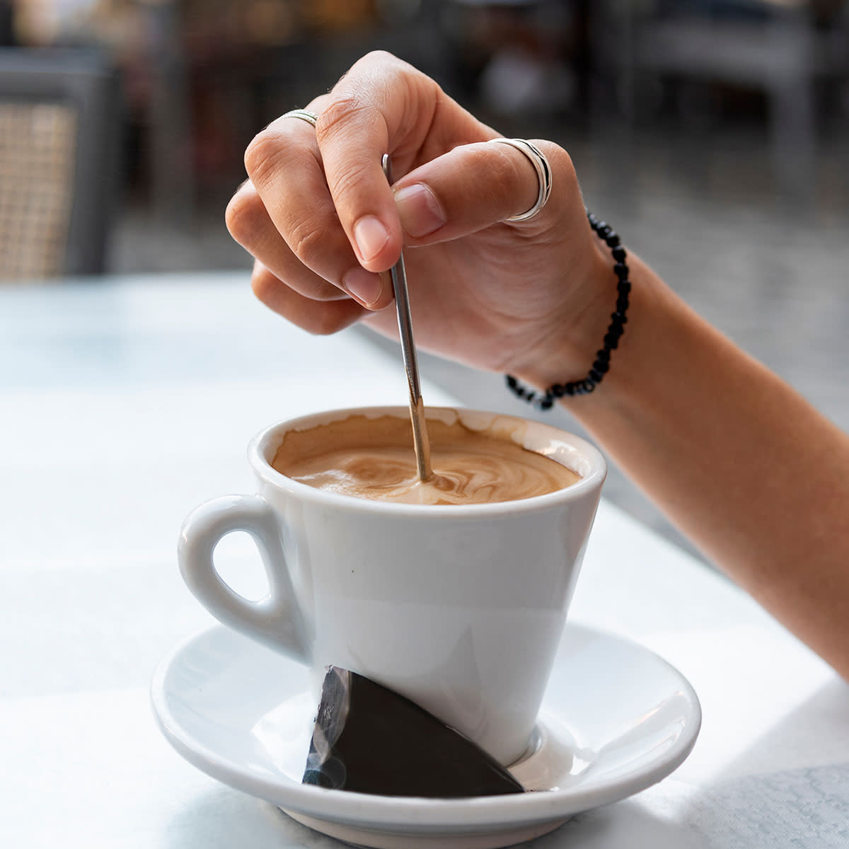 woman stirring coffee