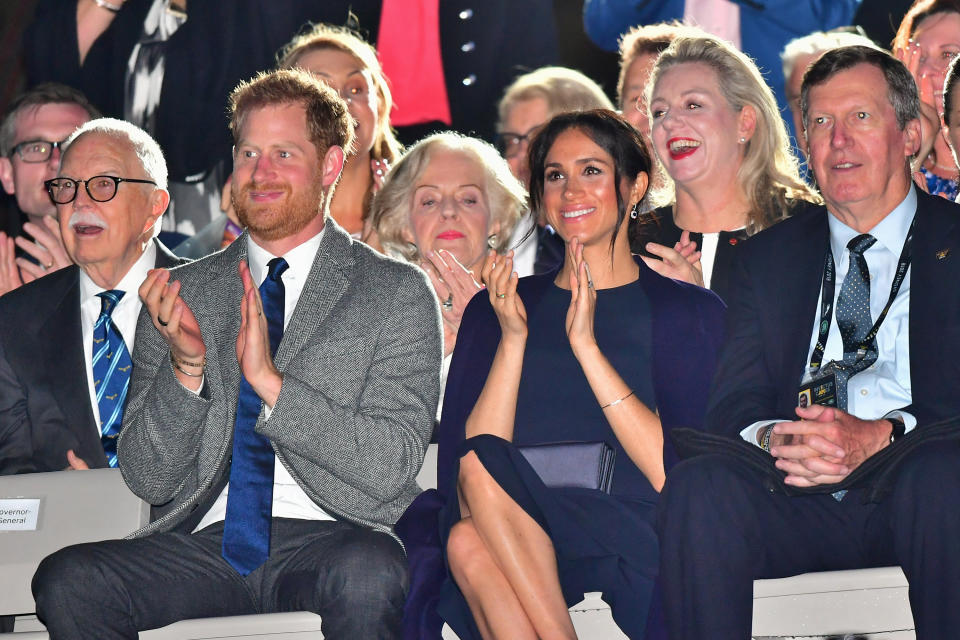 The Duke and Duchess of Sussex enjoying the Invictus Games opening ceremony at Sydney’s Opera House on Saturday night. Photo: Getty