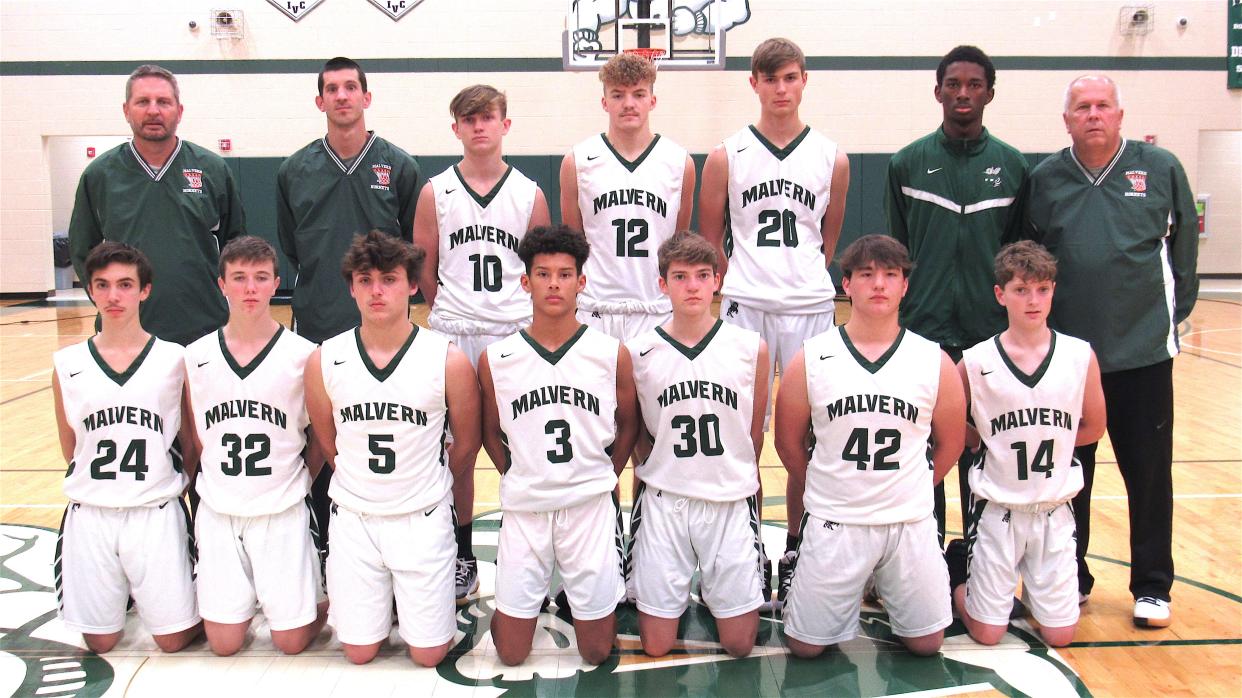 Members of the 2021-22 Malvern boys junior-varsity basketball team are (front row, left to right) Vinton Wagner, Evan Debo, Charles Motz, Rodney Smith, Eric Swain, Dante Passio and Jordin Detchon; and (back row) Coach Todd English, Coach Travis Tucci, Drake Hutchison, Tommy Craven, Jared Witherow, manager Ben Moser and Head Coach Dennis Tucci.