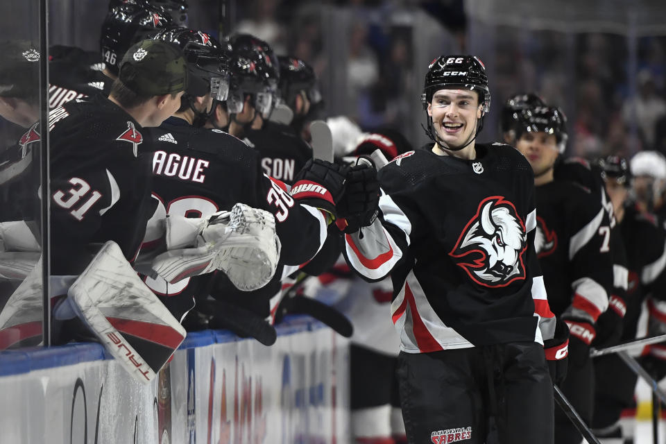 Buffalo Sabres right wing Jack Quinn (22) celebrates after scoring against the New Jersey Devils during the first period of an NHL hockey game in Buffalo, N.Y., Friday, March 24, 2023. (AP Photo/Adrian Kraus)