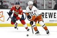 Anaheim Ducks right wing Frank Vatrano, right, controls the puck past Florida Panthers defenseman Gustav Forsling during the first period of an NHL hockey game in Anaheim, Calif., Sunday, Nov. 6, 2022. (AP Photo/Alex Gallardo)