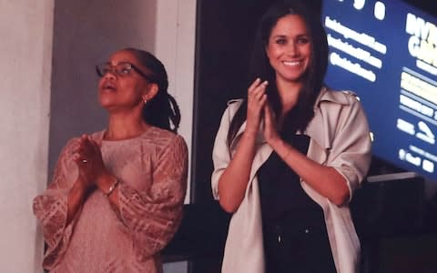 Meghan Markle and her mother, Doria Ragland, watch the closing ceremony for the Invictus Games in Toronto - Credit: MARK BLINCH/Reuters