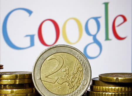 Euro coins are seen in front of a Google logo in this picture illustration taken in Zenica, April 21, 2015. REUTERS/Dado Ruvic