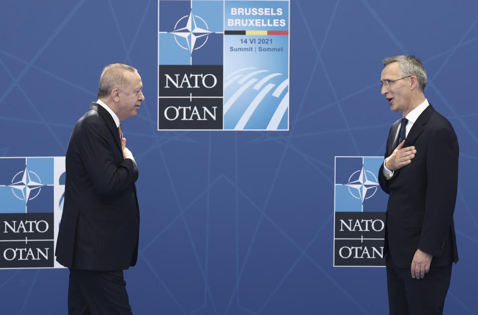 FILE - NATO Secretary General Jens Stoltenberg, right, greets Turkey's President Recep Tayyip Erdogan as he arrives for a NATO summit at NATO headquarters in Brussels, Monday, June 14, 2021. (Kenzo Tribouillard, Pool via AP, File)